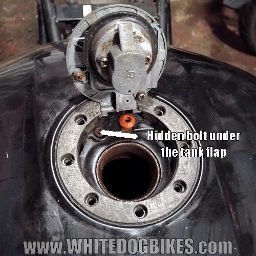 Location of the securing allen bolt under the tank flap