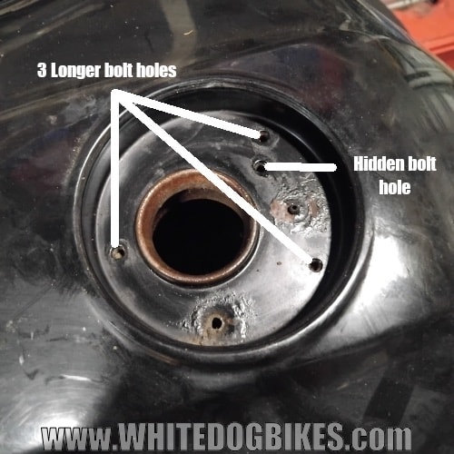 Allen bolt holes in the tank under the tank cap