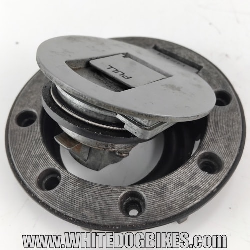 Top view of an aircraft style filler cap removed from a bike