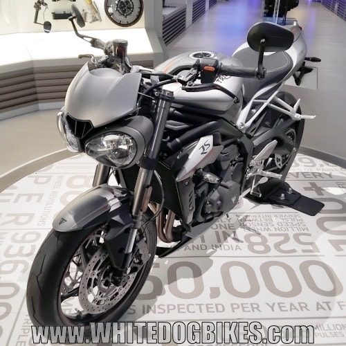 Triumph Street Triple RS, 765cc in silver on a circular display podium