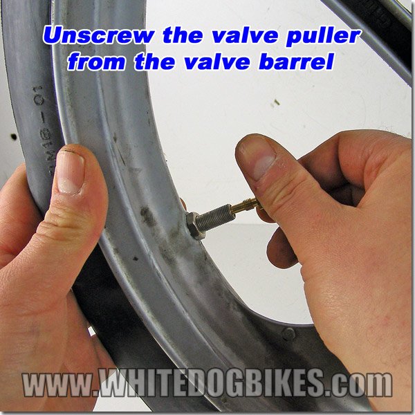 Unscrew the valve tool head from the valve