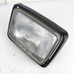 OEM Kawasaki GT550 (Z550GT) used headlight in black with light surface rust on the case