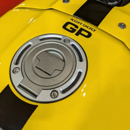 Yamaha XSR900 filler cap on a yellow petrol tank